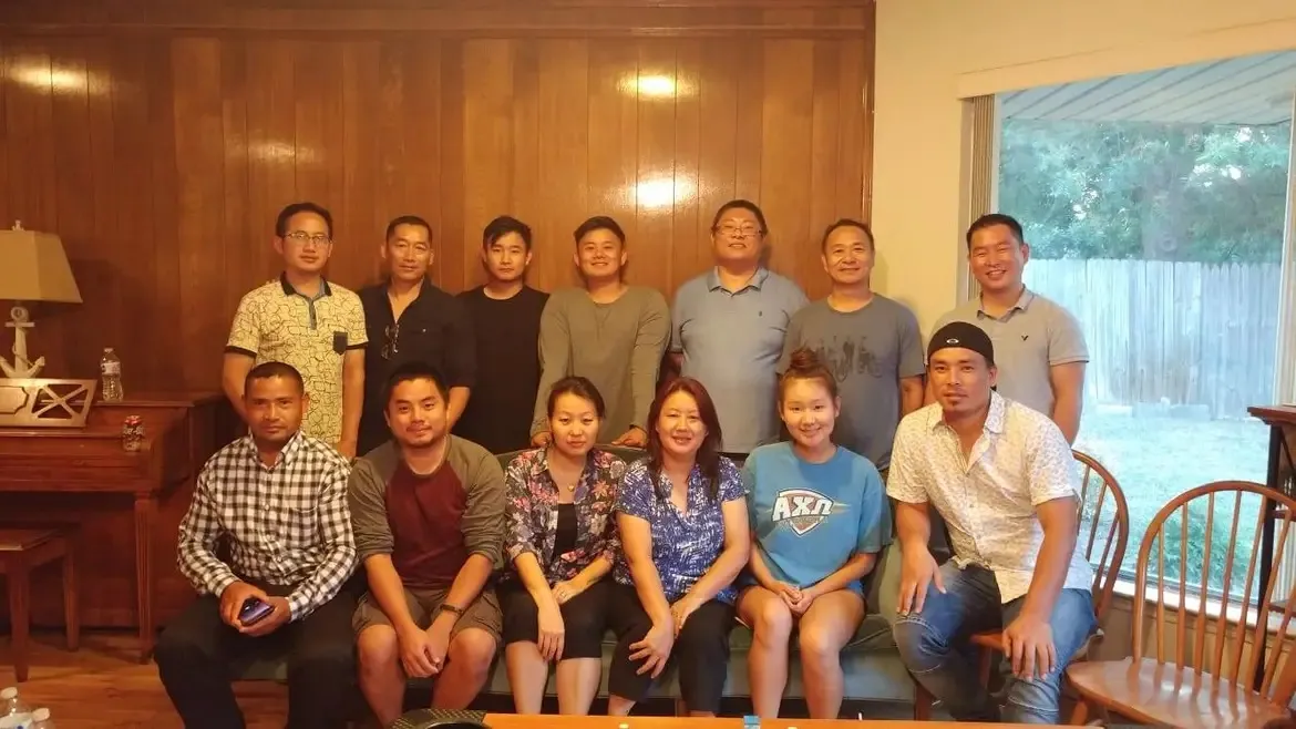 Early First Naga Baptist Church members gathered for a group portrait in a home